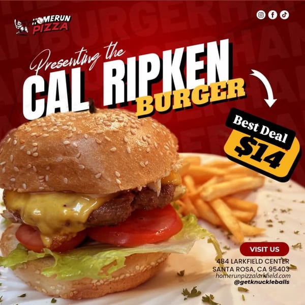 A Homerun Pizza Cal Ripken Burger with melted cheese, lettuce, tomato, and a side of fries.